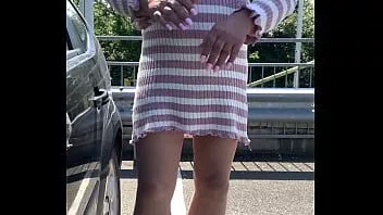 play Kelly cd on a carpark in pink jumper dress and nude pantyhose