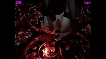 Play Hotty girl having fun before a candle in the dark